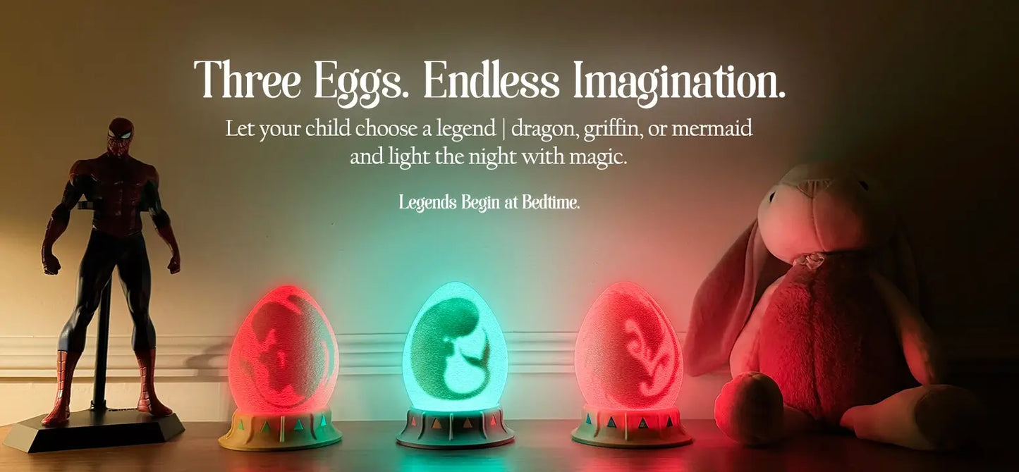trio of dragon, mermaid, and griffin egg nightlights glowing on kids’ shelf between toys