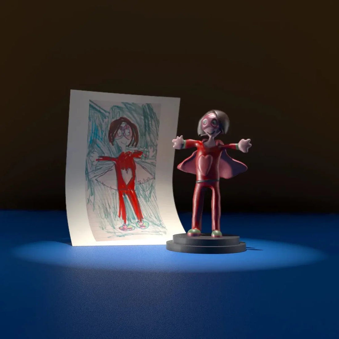 a Childhood drawing of a super hero mom next to the figurine that it was made based on. 
