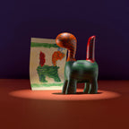 Ostaneskids custom animal figurine inspired by a child’s zebra drawing and displayed next to the original art