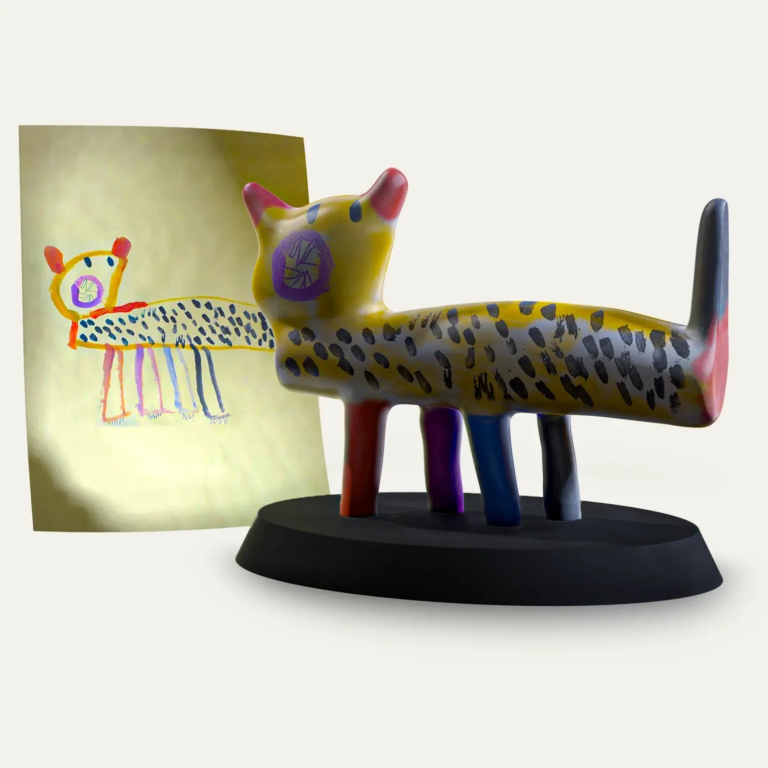 A child’s colourful drawing of a spotted leopard is transformed into a handcrafted figurine, standing beside the original artwork as a personalised keepsake with embedded audio memory.