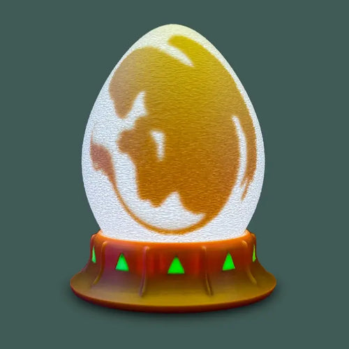 griffin egg nightlight with green stand for kids who dream of guarding skies